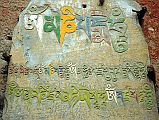207 Kagbeni Mani Stone The ancient Bon religion gave way to Buddhism, symbolized by this mani stone in Kagbeni, with the most famous mantra Om Mani Padme Hum.